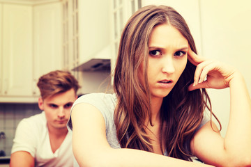 Fototapeta premium Couple having an argument in the kitchen.