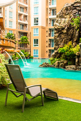 Swimming pool chair./ Relaxing poolside swimming pool chair.
