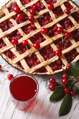American cherry pie and juice close-up vertical top view
