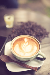 Latte Art coffee with coffee bean vintage color