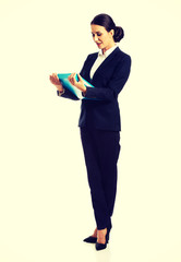 Businesswoman holding a binder