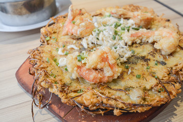 Fried mussel pancakes in hot plate, Thai style.