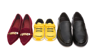 three pairs of shoes for dad mom and son on white with clipping path, family concept