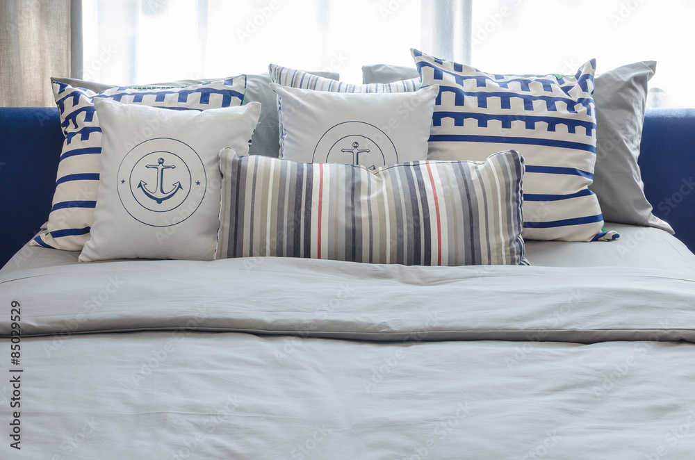 Wall mural pillows on modern blue bed in bedroom