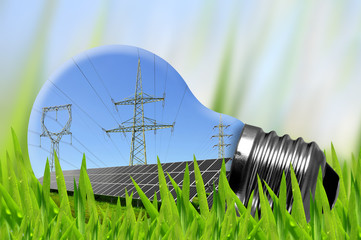 Solar panels and high voltage pylons in light bulb.