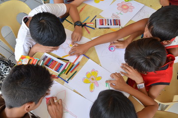 Children drawing in art workshop