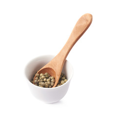 Green peppercorn in a cup isolated