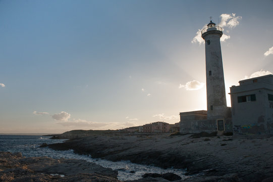 Lighthouse before the sunset and the sunrays behind it