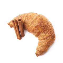 Croissant pastry and cinnamon sticks