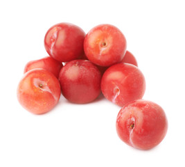 Pile of multiple red plums isolated