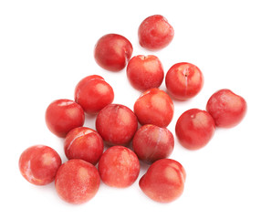 Pile of multiple red plums isolated