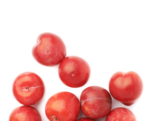 Pile of multiple red plums isolated