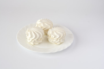 Vanilla marshmallows on a white dish