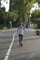 Fototapeta premium woman jogging on the jogging path