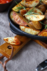 Tasty baked potatoes in a frying pan
