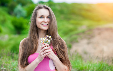 Romantic Young Woman outdoors at a summer day.