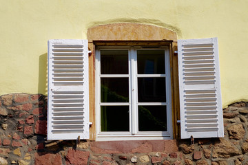 white windows shutter of a half-timbered house