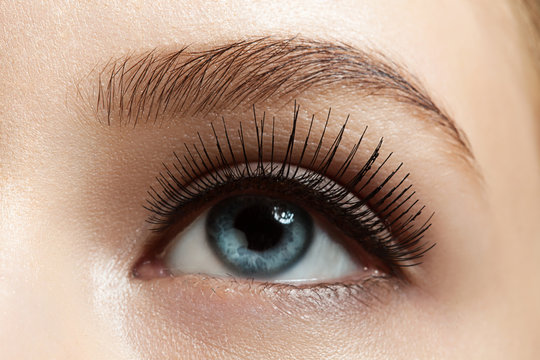 Close-up of make-up eye with long eyelashes