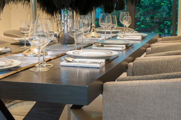 dining table and chairs in modern home with elegant table settin