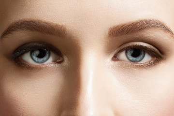 Naklejka premium Close-up of make-up beautiful blue eyes woman