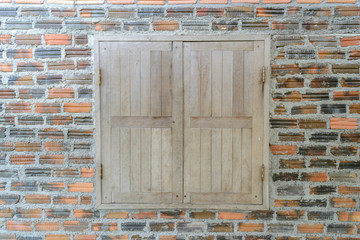 wood windows and brick wall 