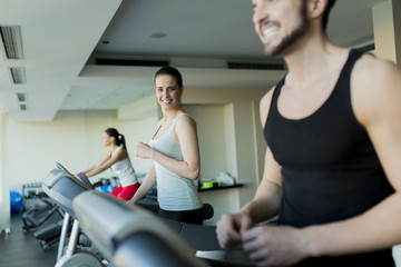 Fototapeta premium Young woman in the gym