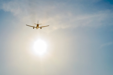 airplane over sun rays background ,Shot from the bottom