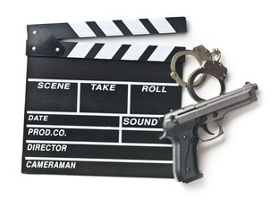 Obraz premium movie clapper and gun with handcuffs