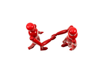 Red wooden art models shaking hands looking from above