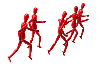 Red wooden art models group running away into distance