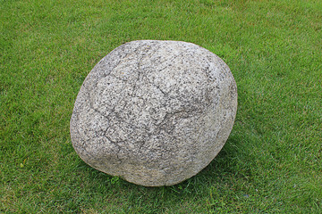 Obraz na płótnie Canvas big stone in the grass