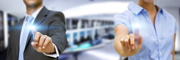 Man and woman using digital interface