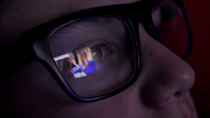 Young boy watching tv at night

