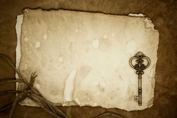 Old keys on old paper background
