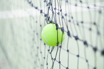 Tennis ball in net