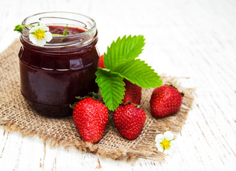 Strawberry jam and fresh strawberries