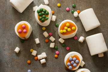 white marshmallow and caramel colored candies