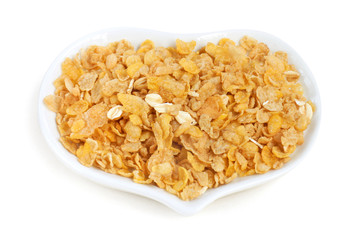 Cornflakes in white dish.