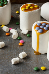 white marshmallow and caramel colored candies