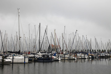 Boats in harbor during bad weather.