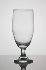 Empty glass of beer on white background