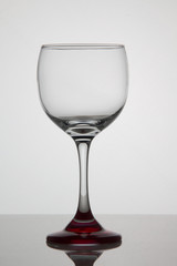 Empty glass of wine on white background