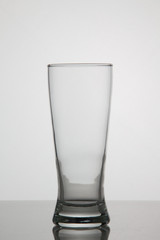 Empty glass of beer on white background