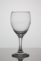Empty glass of wine on white background