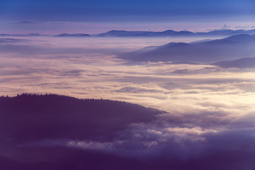 Colorful  sunrise in the mountains.Fog in the valley.