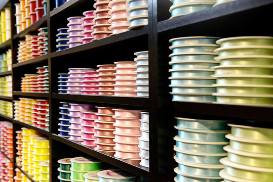 Various Colored Ribbons on Wooden Display Stand