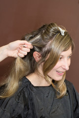 Portrait of a blond woman at hairdresser