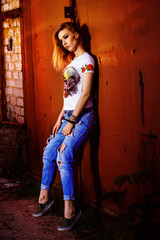 Beautiful young model woman in jeans and handmade shirt