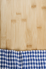 Wooden table covered with tablecloth cloth checkere