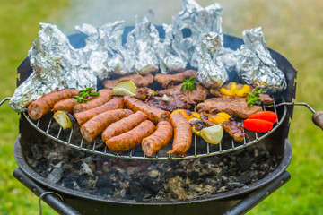 Assorted grilled meat with vegetable on a barbecue